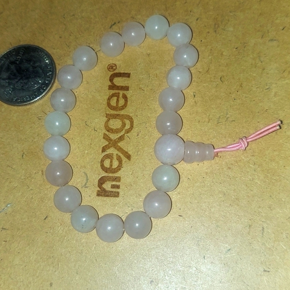 Gorg rose quartz crystal bracelet on strechy pink cord